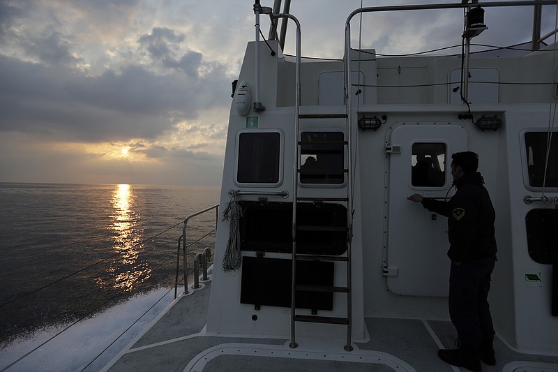 
              In this photo taken on Friday, March 17, 2017 the sun rises as a Greek coast guard vessel patrols on the Aegean Sea near the northeastern Greek island of Lesbos. The waters off northern Lesbos once resounded to the shrieks of the drowning, the whine of outboard motors as refugees struggled to reach Europe alive, and the thudding of rescue helicopter engines. A million people crossed the straits between Turkey and Greece’s eastern Aegean islands in the year before March 20, 2016, and hundreds drowned. About half of those who made it landed on this island. (AP Photo/Thanassis Stavrakis)
            