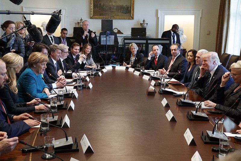 President Donald Trump and German Chancellor Angela Merkel participate in a roundtable discussion on vocational training with German and American business leaders, Friday, March 17, 2017, at the White House in Washington. (AP Photo/Evan Vucci)