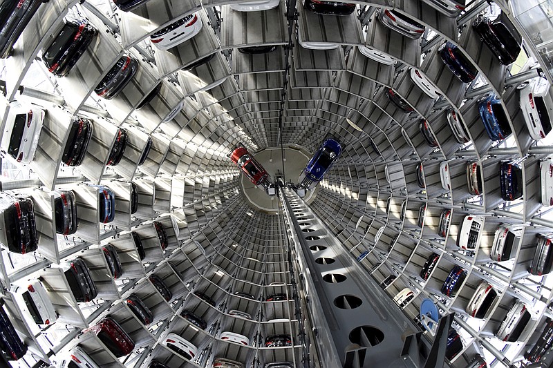 
              Volkswagen cars are lifted inside a delivery tower of the company in Wolfsburg, Germany, Tuesday, March 14, 2017. The CEO of German automaker Volkswagen says the United States remains a "core market" for the company despite its diesel emissions scandal and has underlined that it hopes to expand there. Matthias Mueller made the comments Tuesday at the company's annual news and investor conference at its headquarters in Wolfsburg, Germany.  (Rainer Jensen/dpa via AP)
            