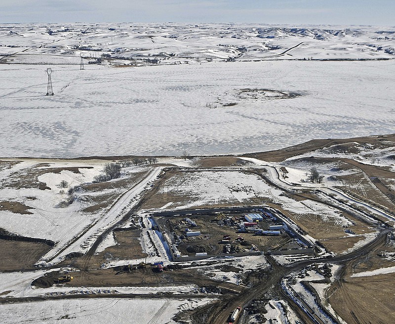 
              FILE - This Feb. 13, 2017, aerial file photo, shows a site where the final phase of the Dakota Access pipeline is taking place with boring equipment routing the pipeline underground and across Lake Oahe to connect with the existing pipeline in Emmons County near Cannon Ball, N.D. Federal Judge James Boasberg on Tuesday, March 14 denied a request by the Standing Rock and Cheyenne River Sioux to stop oil from flowing while they appeal his earlier decision allowing pipeline construction to finish. (Tom Stromme/The Bismarck Tribune via AP, File)
            