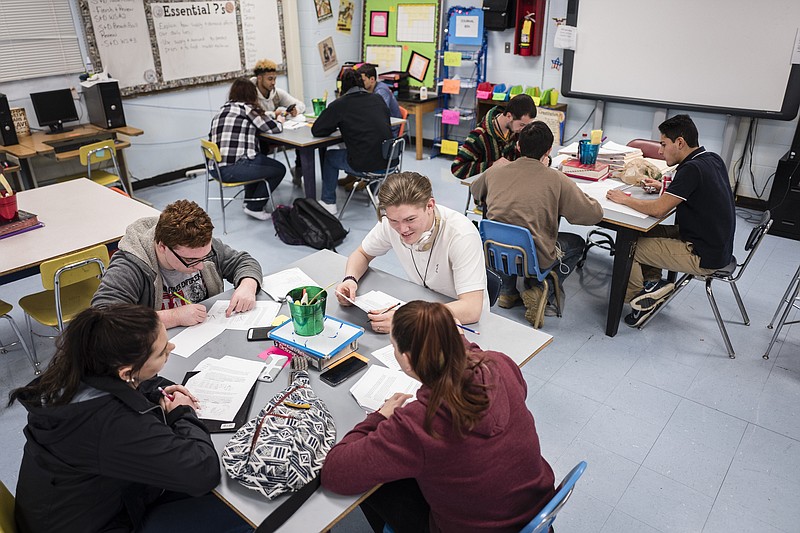 Students complete worksheets in an economics class at Hamilton County High School on Thursday, March 2, 2017, in Harrison, Tenn. The school gives students who have dropped out of school the opportunity to complete their high school diplomas.