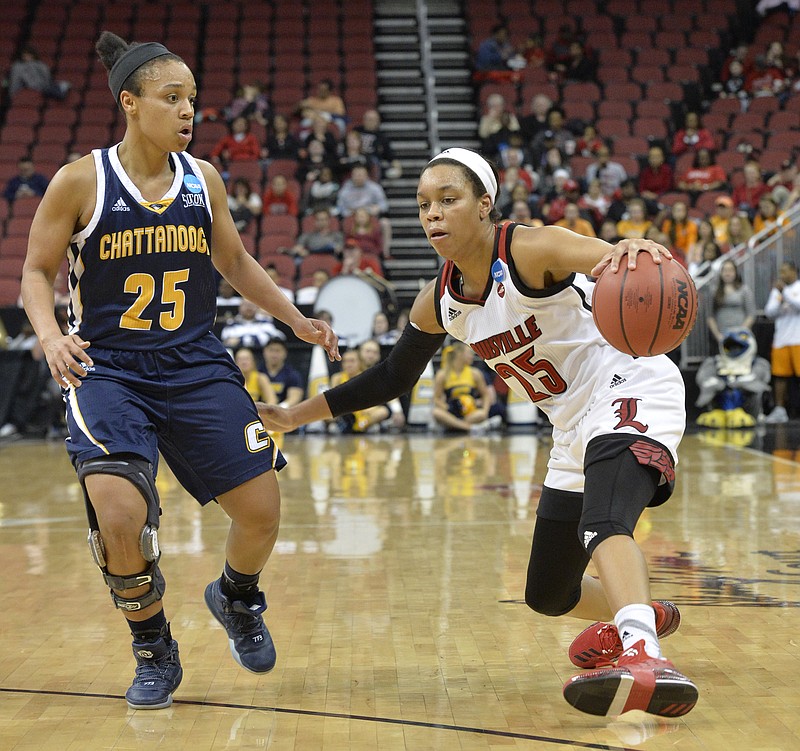 Louisville's Asia Durr (25) attempts to drive around the defense of Chattanooga's Chelsey Shumpert (25) in the second half of a first-round game in the women's NCAA college basketball tournament, Saturday, March 18, 2017, in Louisville, Ky. Louisville won 82-62. (AP Photo/Timothy D. Easley)