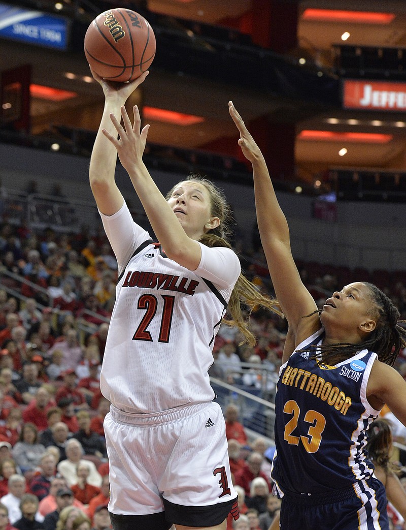 Louisville's Kylee Shook (21) shoots over the defense of Chattanooga'sMoses Johnson (23) in the second half of a first-round game in the women's NCAA college basketball tournament, Saturday, Mar. 18, 2017, in Louisville, Ky. Louisville won 82-62. (AP Photo/Timothy D. Easley)