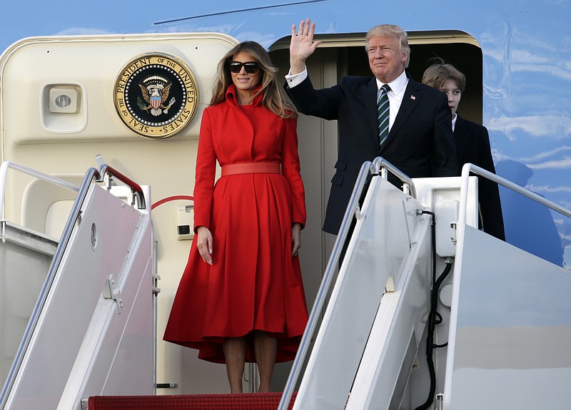 
              President Donald Trump waves from Air Force One with First Lady Melania and son Barron after arriving at the Palm Beach International Airport, Friday, March 17, 2017, in West Palm Beach, Fla. Trump is spending the weekend at his Mar-a-Lago Estate in Palm Beach. (AP Photo/Lynne Sladky)
            