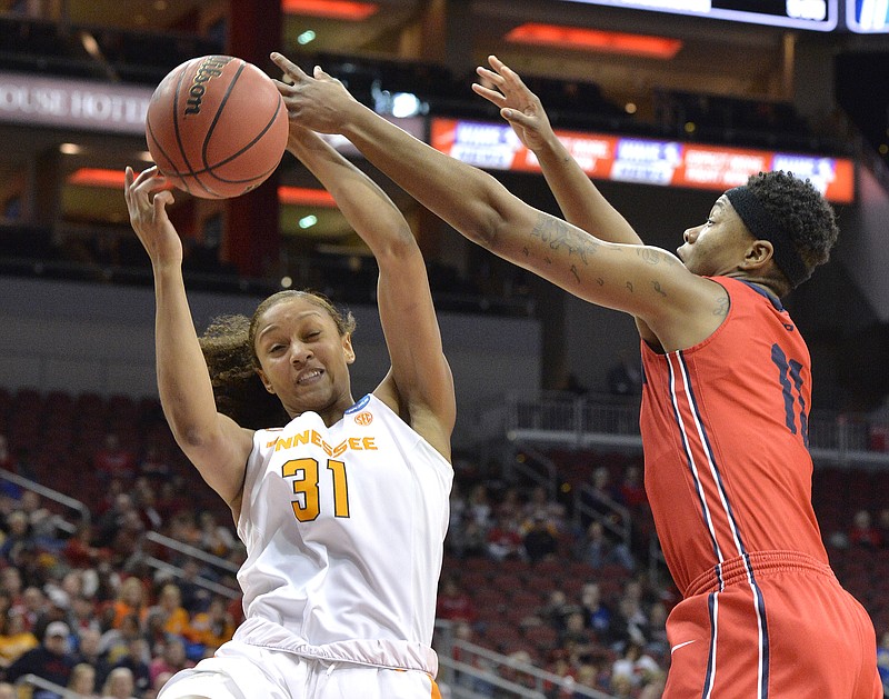 Tennessee's Jaime Nared (31) battles Dayton's Alex Harris (11) for a rebound in the first half of a first-round game in the women's NCAA college basketball tournament, Saturday, March 18, 2017, in Louisville, Ky. Louisville won 82-62. (AP Photo/Timothy D. Easley)

