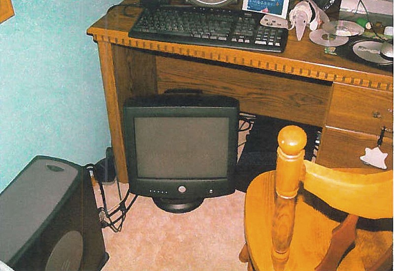 
              This image provided by the Lacey Police Department shows a June 14, 2007, photo of a computer taken from the bedroom of the Timberline High School bomb hoaxer in Lacey, Wash. In 2007, a teenager who was sending bomb threats to his high school in Washington state was finally caught by an FBI agent posing as a journalist.  Local police raided the home hours after the FBI pinpointed his location using surveillance software. The Associated Press obtained a copy of the photo, taken by investigators, via a public records request. (Lacey Police Department via AP)
            