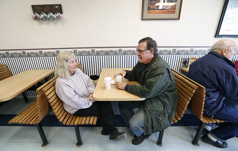
              In this Thursday, March 16, 2017 photo, Pat Luther, of Jefferson, Iowa, left, talks with her husband Dave, at Bunkers Dunkers Bakery in Jefferson, Iowa. Outside his sprawling Iowa congressional district, Republican U.S. Rep. Steve King's stream of inflammatory comments generate outrage and condemnation, but back home they rate little more than a shrug. (AP Photo/Charlie Neibergall)
            
