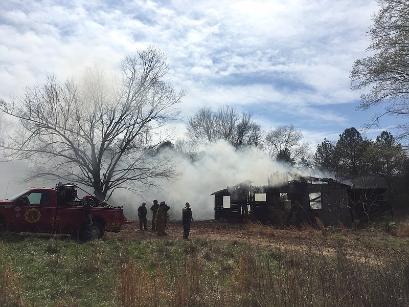 A vacant home burned in Harrison on Saturday, setting off a small brush fire.