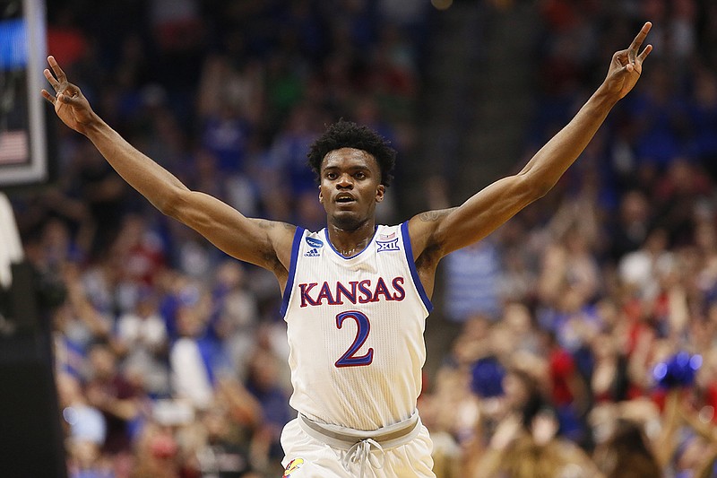 Kansas guard Lagerald Vick (2) celebrates in the second half of a second-round game against Michigan State in the men's NCAA college basketball tournament in Tulsa, Okla., Sunday, March 19, 2017. (AP Photo/Sue Ogrocki)