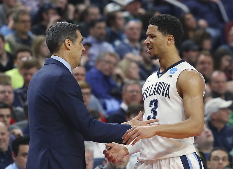 
              Villanova coach Jay Wright and guard Josh Hart talk during the second half of a second-round game against Wisconsin in the NCAA men's college basketball tournament, Saturday, March 18, 2017, in Buffalo, N.Y. Wisconsin won p65-62. (AP Photo/Bill Wippert)
            