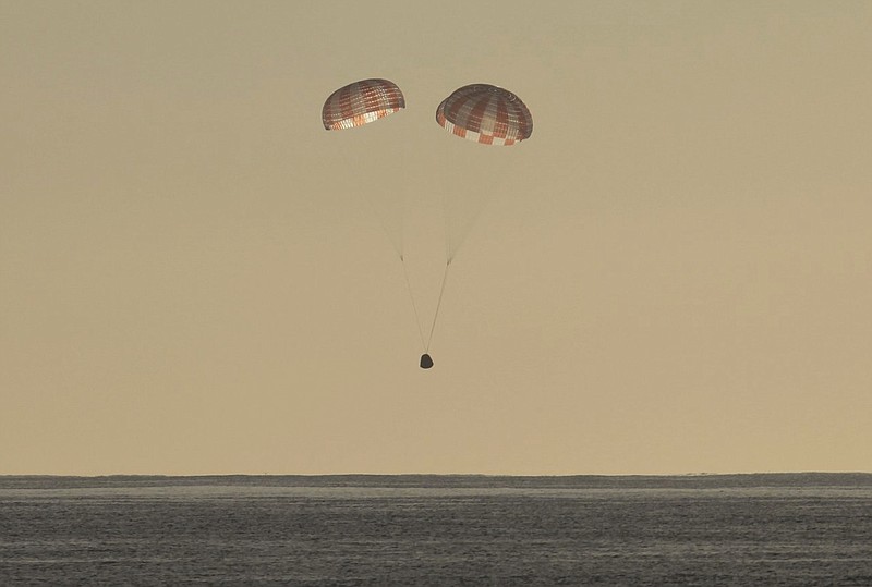
              In this photo provided by SpaceX, the Dragon cargo ship parachutes into the Pacific off the Southern California coast on Sunday, March 19, 2017. Astronauts set it free from the International Space Station about 5½ hours earlier. (SpaceX via AP)
            