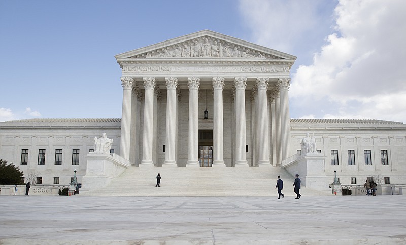 
              In this photo taken March 3, 2017, the Supreme Court in Washington. The Supreme Court could make it easier for landowners to get paid when government rules make their property less valuable. Justices hear arguments Monday in a dispute over a Wisconsin family’s effort to sell a riverfront plot they say has been stripped of value by conservation rules.  (AP Photo/J. Scott Applewhite)
            