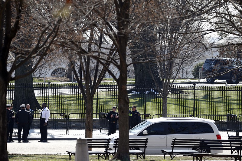 
              US Secret Service officers stand in the cordoned off area on Pennsylvania Avenue after a security incident near the fence of the White House in Washington, Saturday, March 18, 2017. President Trump was not at the White House at the time of the incident. (AP Photo/Alex Brandon)
            