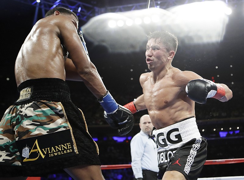 
              Gennady Golovkin, of Kazakhstan, right, fights Daniel Jacobs during the fifth round of a middleweight boxing match early Sunday, March 19, 2017, in New York. Golovkin won the fight. (AP Photo/Frank Franklin II)
            