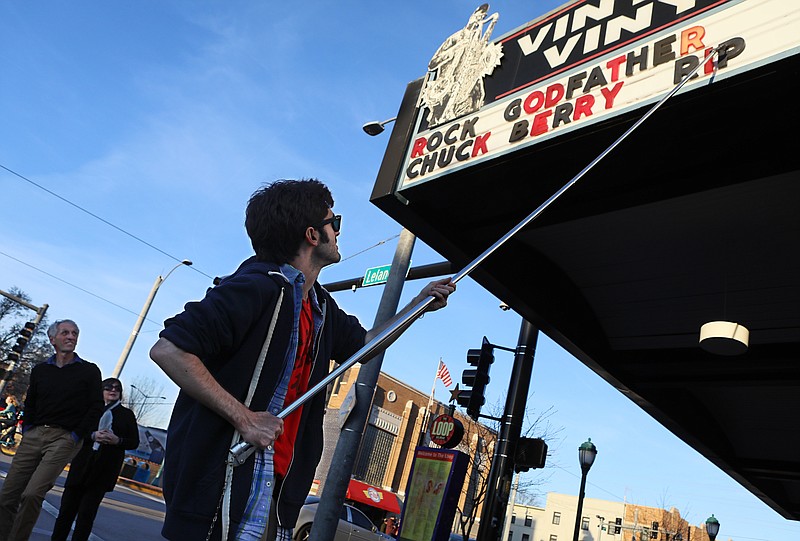 
              Teddy Kogos, of Vintage Vinyl, changes the marquee at the famed record store on the Delmar Loop in University City, Mo., to mark the death of music legend Chuck Berry on Saturday, March 18, 2017.  Berry, rock 'n' roll's founding guitar hero and storyteller who defined the music's joy and rebellion in such classics as "Johnny B. Goode," ''Sweet Little Sixteen" and "Roll Over Beethoven," died Saturday at his home west of St. Louis. He was 90. (David Carson/St. Louis Post-Dispatch via AP)
            