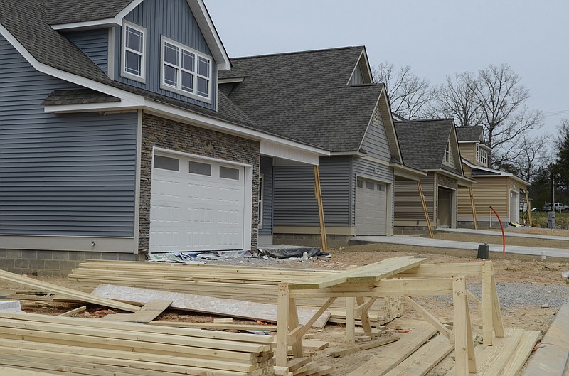 Five houses are seen at various stages of construction in the Stonebrook subdivision, located near the intersection of Wooten Road and Graysville Road in Catoosa County in 2013. Rodney Waters owns 10 lots in Stonebrook, which he plans to develop in the next few months in addition to the rougly 50 lots behind the subdivision.