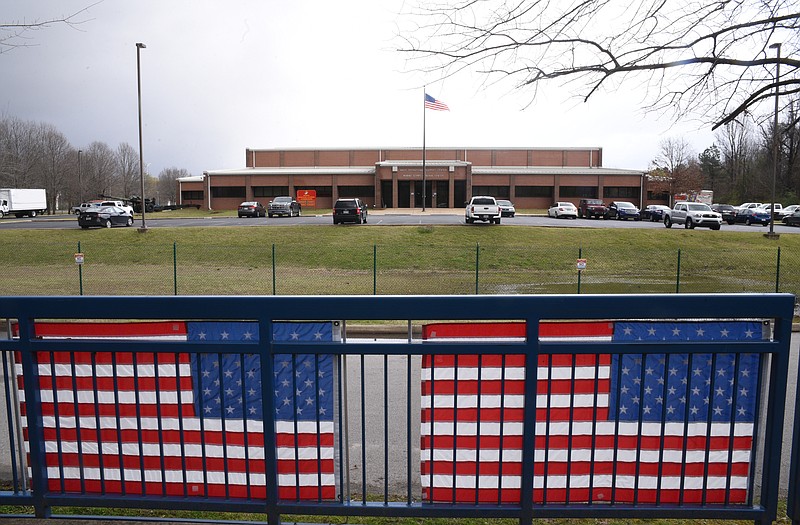 Five flags line the Tennessee Riverwalk in front of the Naval Reserve Center on Amnicola Highway.