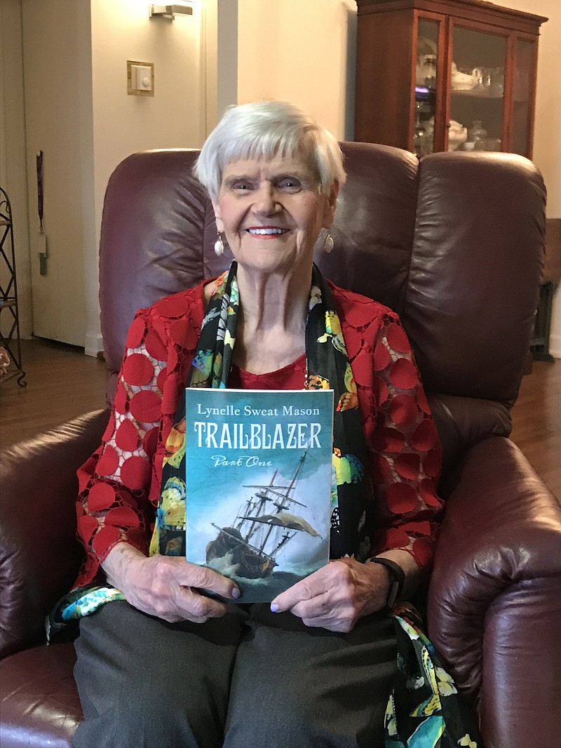 Lynelle Mason holds her new novel, "Trailblazer."