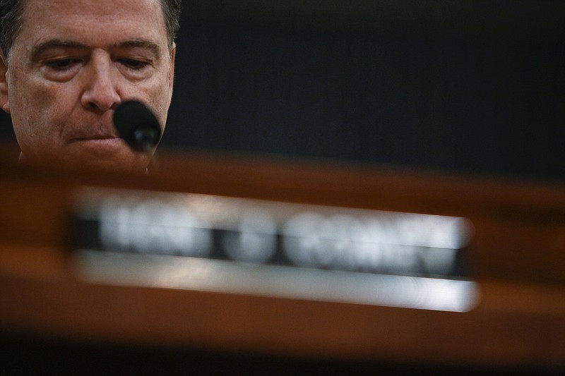 FBI Director James Comey testifies before the House Permanent Select Committee on Intelligence on Capitol Hill, in Washington on Monday. Comey publicly confirmed an investigation into Russian interference in the presidential election and whether associates of the president were in contact with Moscow at the hearing on Monday. (Eric Thayer/The New York Times)