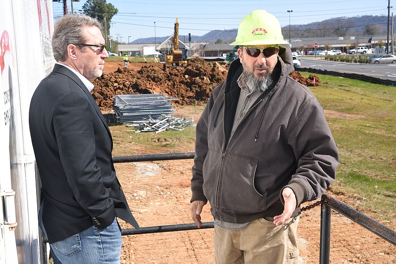 Jeff Londis, president of White Oak Enterprises, talks with Eric Ginsberg, supervisor for P&C Construction, Inc., about the 10-acre tract being developed at 5974 Elementary Way in Ooltewah.