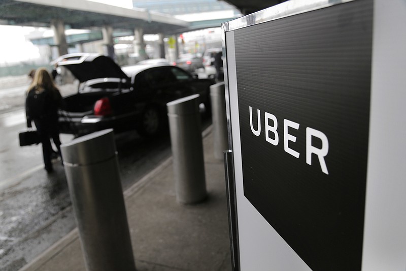 
              FILE - In this Wednesday, March 15, 2017 file photo, a sign marks a pick-up point for the Uber car service at LaGuardia Airport in New York. Jeff Jones, president of the embattled ride-hailing company Uber, has resigned just six months after taking the job, the company confirmed Sunday, March 19. (AP Photo/Seth Wenig, File)
            