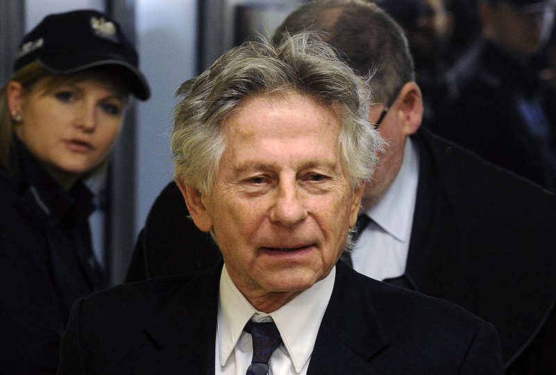 
              FILE - This Feb. 25, 2015 file photo shows filmmaker Roman Polanski during a break in a hearing concerning a U.S. request for his extradition over 1977 charges of sex with a minor, in Krakow, Poland. A judge is scheduled to hear arguments from Polanski's attorney on Monday, March 20, 2017, in the latest effort to bring the fugitive director's 1977 unlawful sex with a minor case to a close. Polanski fled to France in 1978 on the eve of sentencing, and his lawyer is now asking a judge to unseal testimony in the case, and also state whether he believes the Oscar winner has already served his incarceration sentence. (AP Photo/Alik Keplicz, File)
            