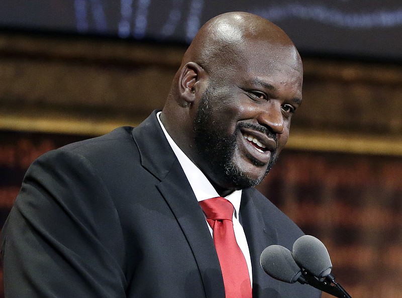 
              FILE - In this Sept. 9, 2016, file photo, basketball Hall of Fame inductee Shaquille O'Neal speaks during induction ceremonies in Springfield, Mass. O'Neal said on the March 20, 2017, edition of his podcast that he believes the world is flat. (AP Photo/Elise Amendola, File)
            