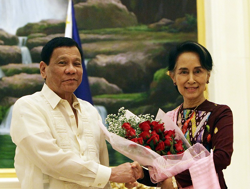 
              Philippine President Rodrigo Duterte, left, shakes hands with Myanmar's State Counsellor Aung San Suu Kyi during their meeting at the Presidential Palace in Naypyitaw, Myanmar, Monday, March 20, 2017. Duterte arrived in Naypyitaw on Sunday at the invitation of Myanmar's President Htin Kyaw for an official visit to the Southeast Asian country. (AP Photo/Aung Shine Oo)
            