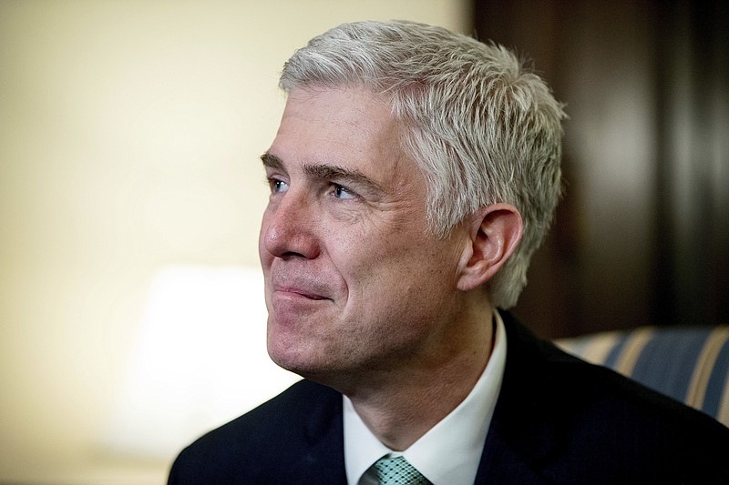 
              FILE - In this Tuesday, Feb. 14, 2017, file photo, Supreme Court Justice nominee Neil Gorsuch meets with Sen. Chris Coons, D-Del. on Capitol Hill in Washington. Thirteen months after Antonin Scalia’s death created a vacancy on the Supreme Court, hearings get under way Monday, March 20, 2017, on Gorsuch, President Donald Trump’s nominee to replace him. (AP Photo/Andrew Harnik, File)
            