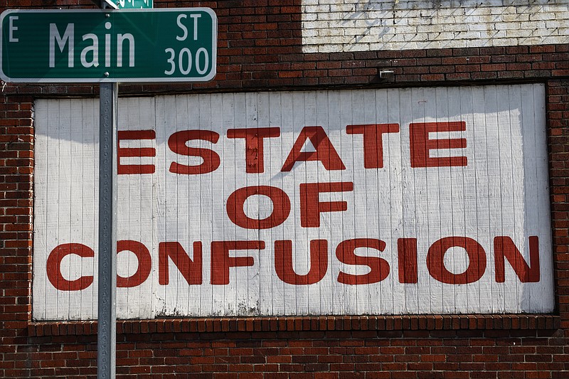 A sign for Estate of Confusion is seen on Main Street on Tuesday, March 21, 2017, in Chattanooga, Tenn. The eclectic shop will be closing on May 1.