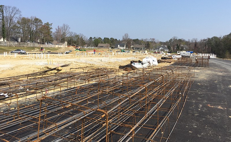 Construction crews from Cameron General Contractors work on a new $30 million senior living complex taking shape at 7683 Shallowford Road