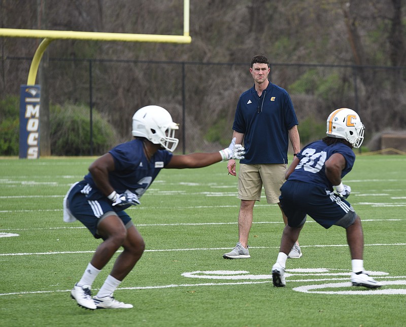 UTC football coach Tom Arth watches his team during spring drills Tuesday afternoon at Scrappy Moore Field.

