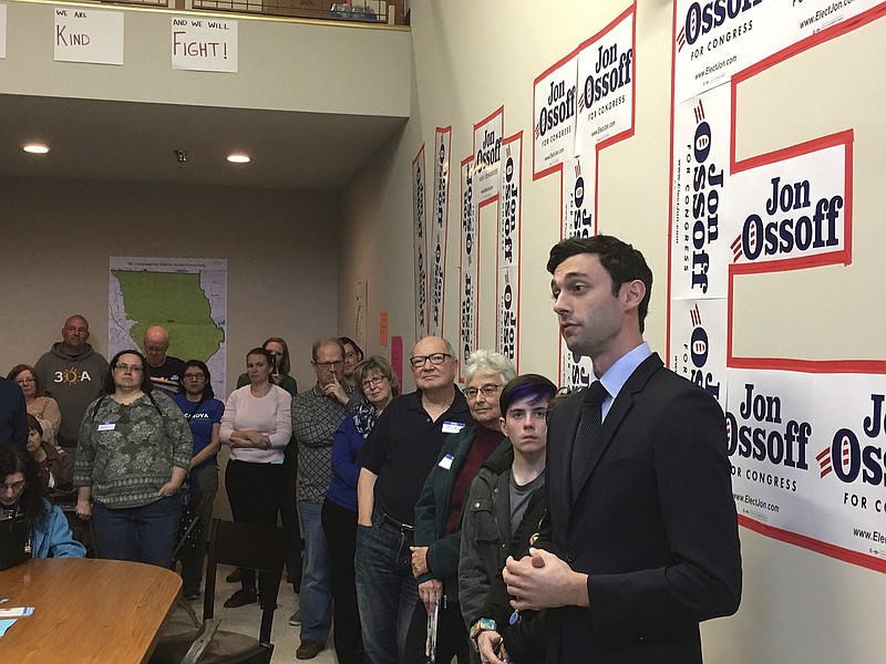 
              In this photo taken March 11, 2017, Georgia Democratic congressional candidate Jon Ossoff speaks to volunteers in his Cobb County campaign office. Ossoff is trying for an upset in a Republican-leaning district outside Atlanta. The primary is April 18 with a likely runoff on June 20. Republicans have begun to attack Ossoff, a move the candidates says "shows we can win." (AP Photo/Bill Barrow)
            