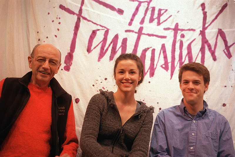 
              FILE - This Jan. 13, 2002 file photo shows members of the off-Broadway show "The Fantasticks," James Cook, left, production stage manager, and actors Natasha Harper and Jeremy Ellison-Gladstone in New York.  The off-Broadway phenomenon will end its record-breaking run this summer. Producers said Tuesday, March 21, 2017,  that the musical will close June 4, having played a total of 21,552 performances in New York City.  (AP Photo/Jim Cooper)
            