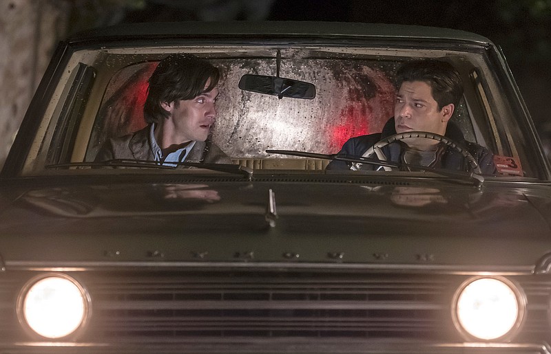 
              In this image released by NBC, Milo Ventimiglia, left, and Jeremy Luke appear in a scene from "This is Us."  The heartwarming NBC series was second only to CBS' "NCIS" for the most popular show of the week for its debut season finale last week. The show reached 12.8 million viewers on the night it first aired, with the audience swelling to 16.9 million when people who watched via time delay over three days is added in, the Nielsen company said. (Ron Batzdorff/NBC via AP)
            