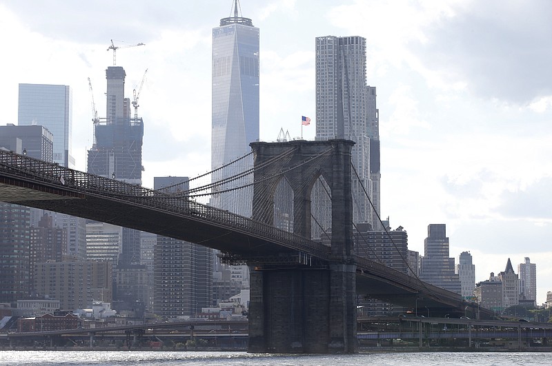 
              FILE - In this June 30, 2016 file photo, the Brooklyn Bridge spans the East River from Brooklyn into Manhattan, as seen from Brooklyn Bridge Park, in New York. The Department of Justice has taken the rare step of seeking to strip a convicted terrorist, Iyman Faris, 47, of his U.S. citizenship as he serves the last several years of a 20-year prison sentence for plotting to destroy New York's Brooklyn Bridge. Some national security experts suggested Tuesday, March 21, 2017, the move might signal a new, tougher line under President Donald Trump. (AP Photo/Kathy Willens, File)
            