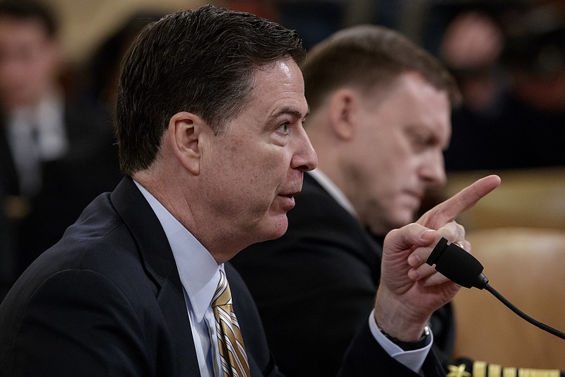 
              FBI Director James Comey, left, and National Security Agency Director Michael Rogers, testify on Capitol Hill in Washington, Monday, March 20, 2017, before the House Intelligence Committee hearing on allegations of Russian interference in the 2016 U.S. presidential election. (AP Photo/J. Scott Applewhite)
            