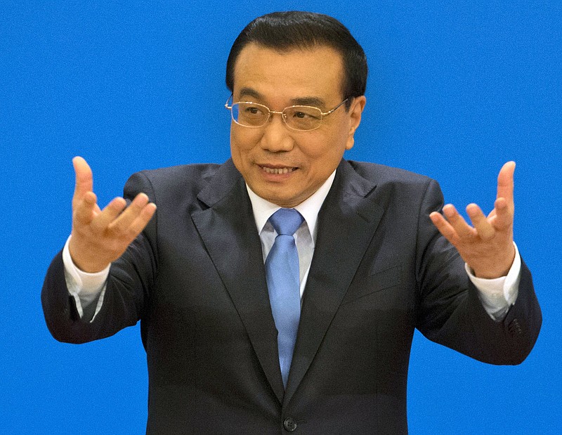 
              FILE - In this March 15, 2017, file photo, Chinese Premier Li Keqiang speaks at a press conference after the closing session of the National People's Congress at the Great Hall of the People in Beijing. Li is due to arrive in the Australian capital Canberra on Wednesday, March 22, 2017, on a mission to expand bilateral ties as U.S. President Donald Trump proposes an “America First” overhaul of global trade. Li’s visit to Australia and New Zealand is the first by a Chinese premier in 11 years. (AP Photo/Ng Han Guan, File)
            