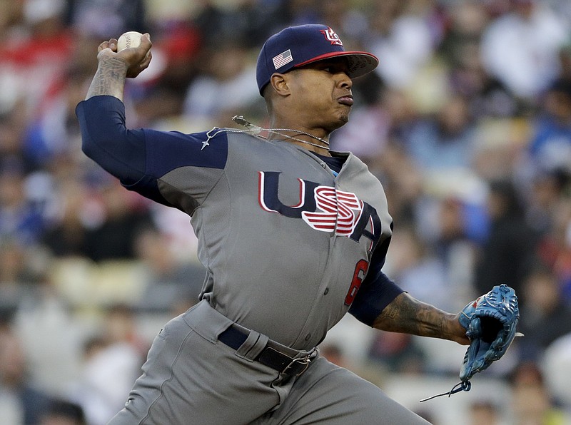 
              U.S. pitcher Marcus Stroman throws against Puerto Rico during the first inning of the final of the World Baseball Classic, in Los Angeles, Wednesday, March 22, 2017. (AP Photo/Jae C. Hong)
            