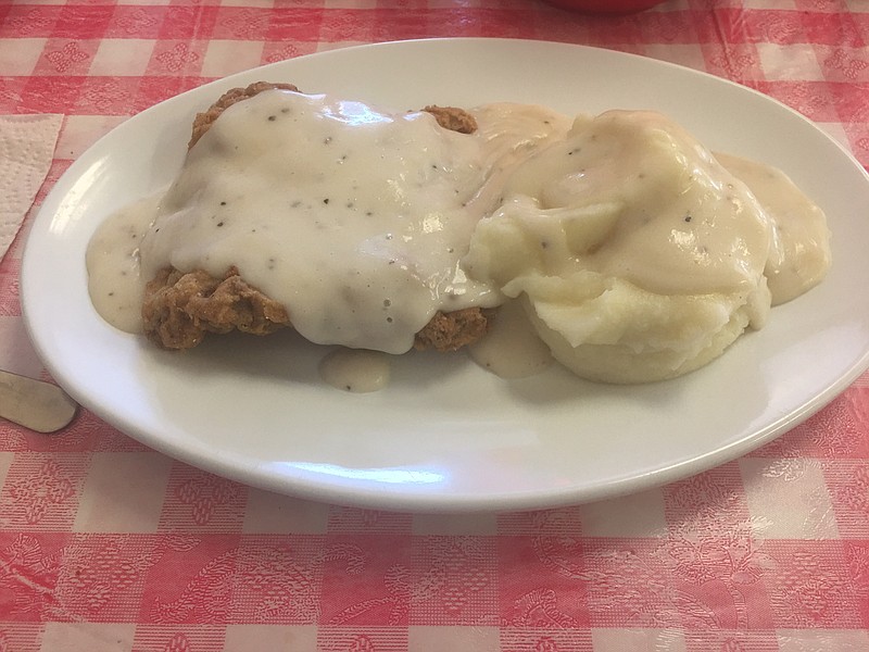 Country-fried steak and mashed potatoes are smothered in a rich, peppery white gravy at Ellie's Catfish Cafe. (Photo by Gilbert Strode)