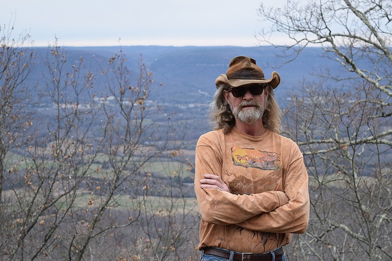 Jeff Styles, WGOW-FM radio show host and avid outdoorsman, poses near his home on Lewis Chapel Mountain.