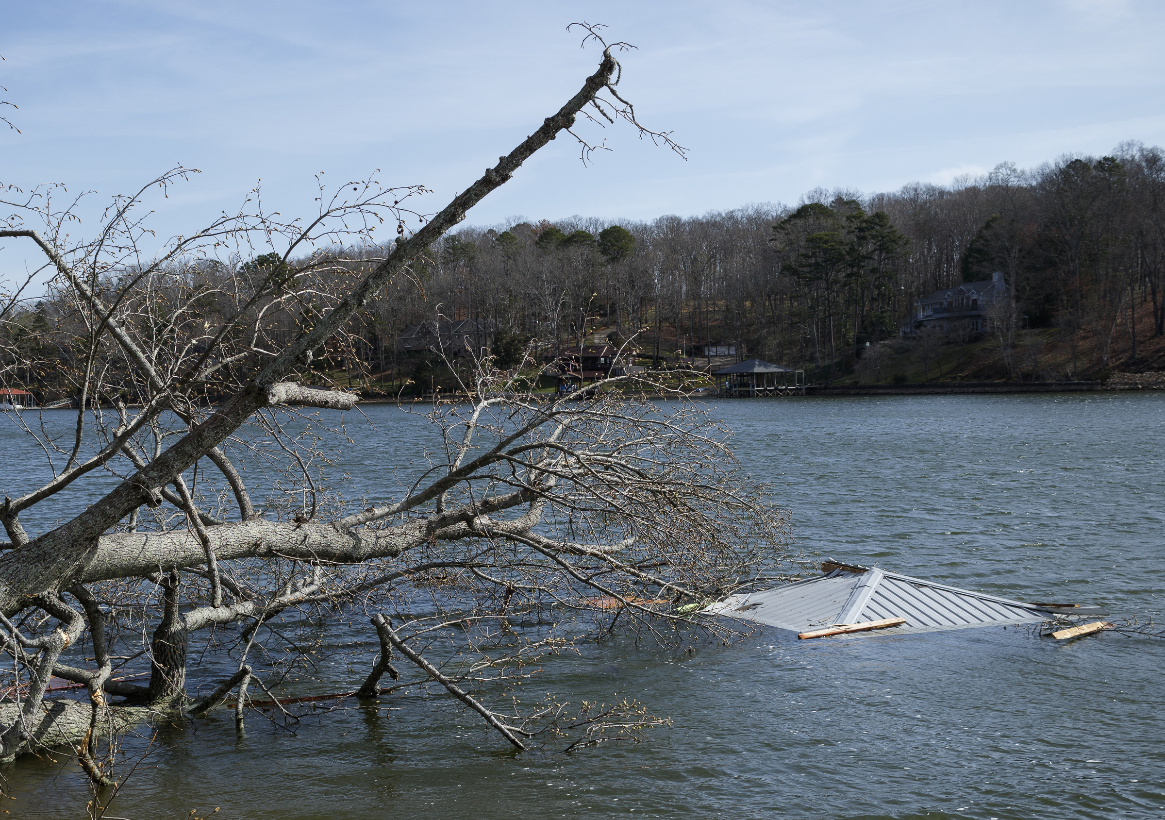 The roof of a building floats in Dallas Bay near Berkeley Lane on Wednesday, March 22, 2017, in Hixson, Tenn., after Tuesday evening storms caused isolated damage throughout the region.