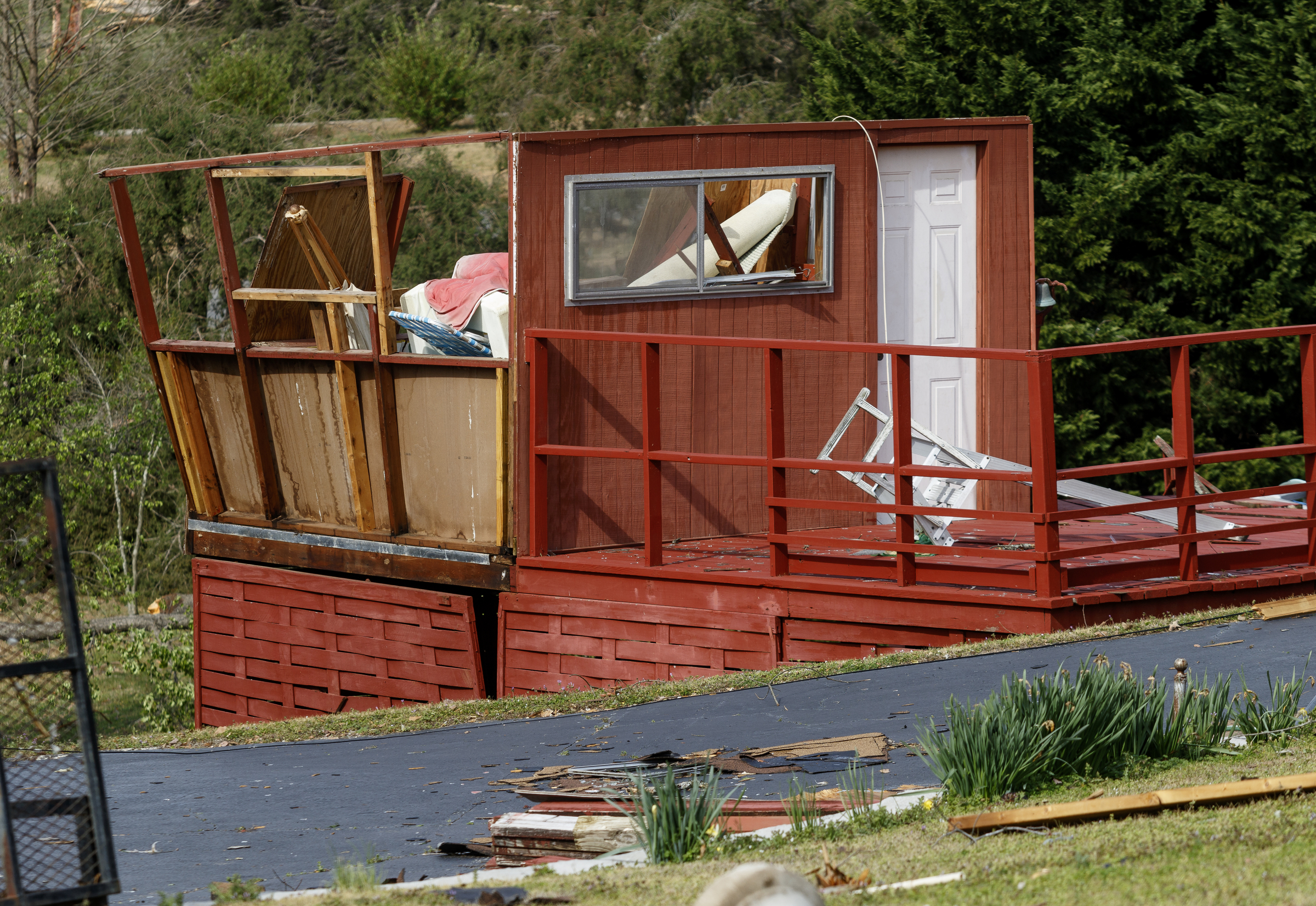 A damaged outbuilding is seen on Berkeley Lane on Wednesday, March 22, 2017, in Hixson, Tenn., after Tuesday evening storms caused isolated damage throughout the region.