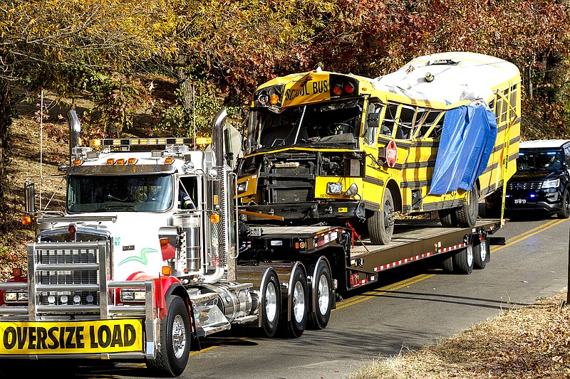 A wrecker removes the bus from the scene at Talley Road in Chattanooga on Nov. 22, 2016, the day after the fatal Woodmore Elementary School bus crash.