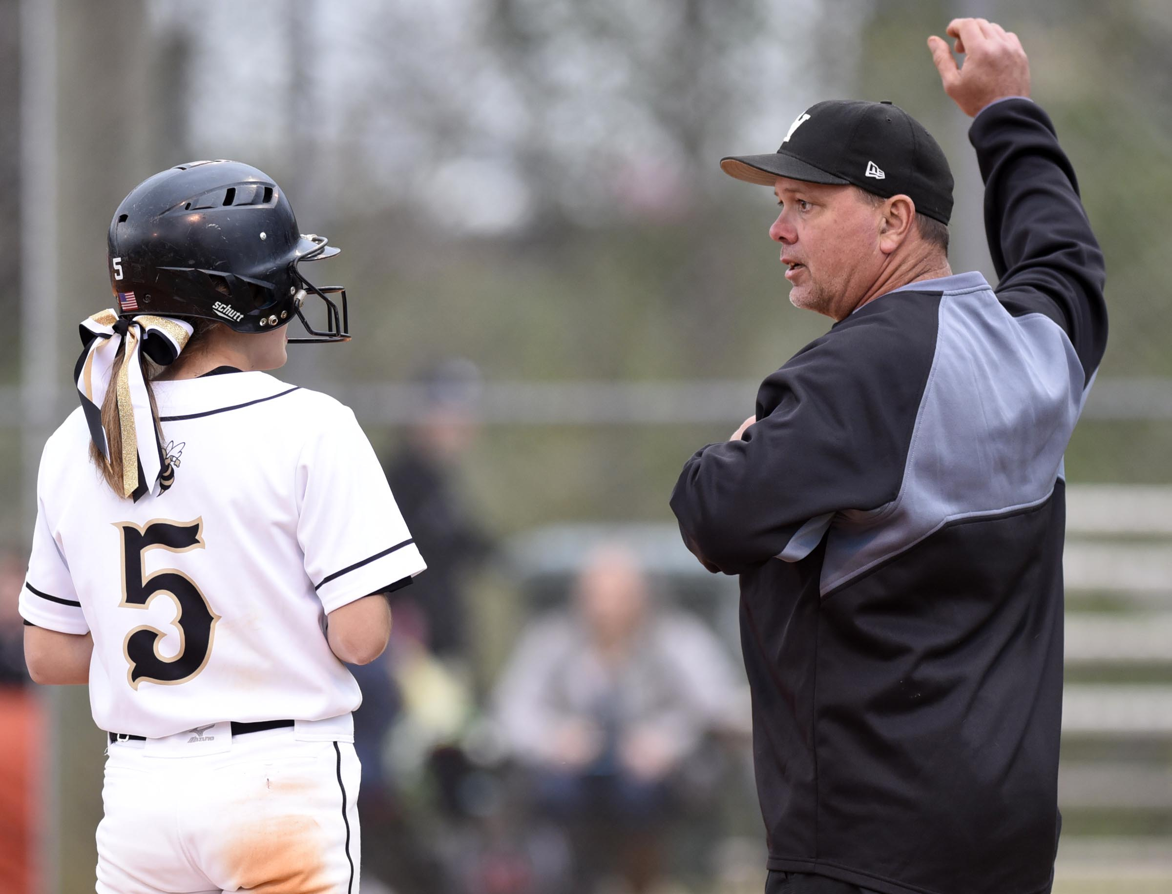 Staff Photo by Robin Rudd Lookout Valley head coach David Dinger instructs his daughter Katie Dinger (5) at third base during a recent softball game.