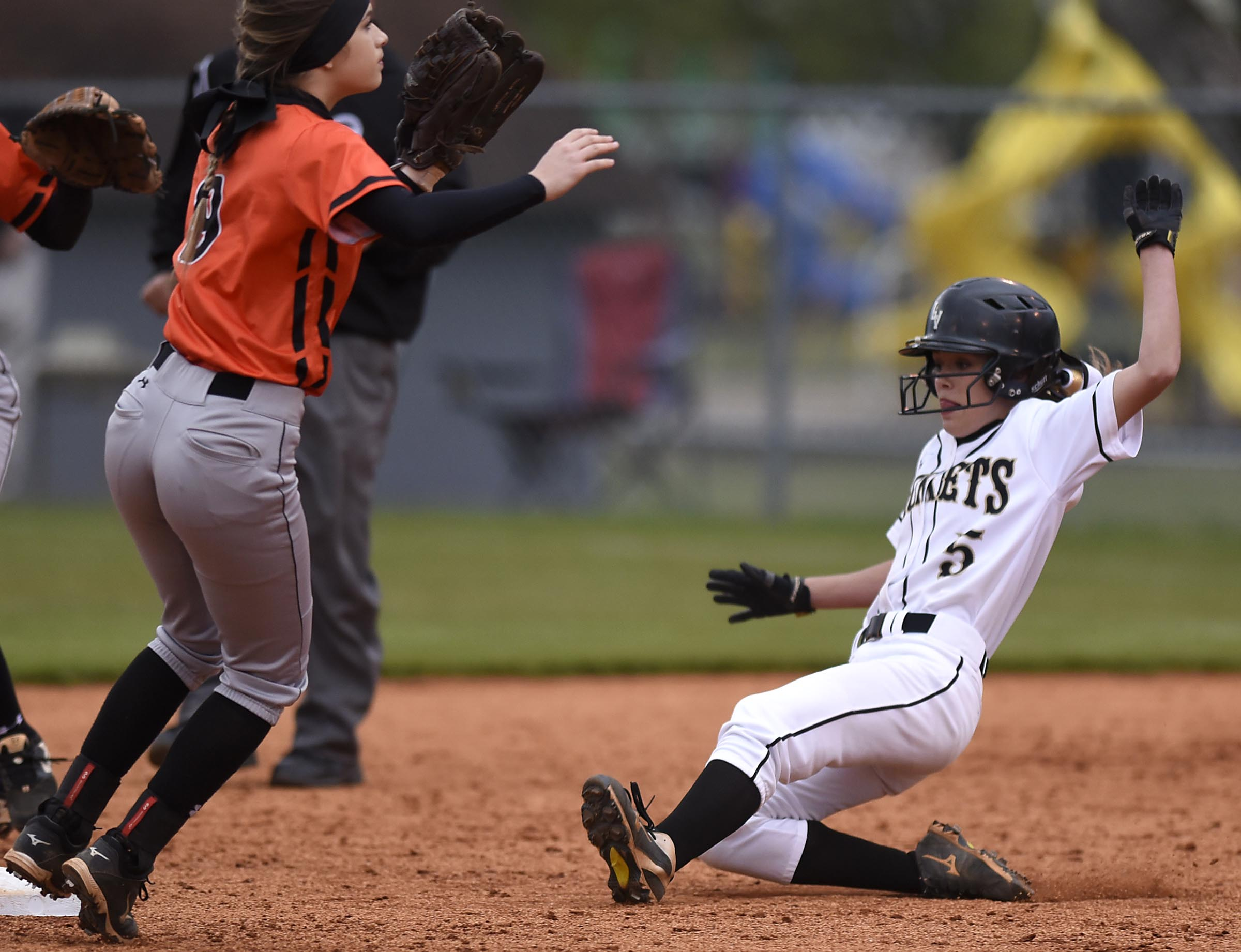 Staff Photo by Robin Rudd Lookout Valley's Katie Dinger (5) steals second base as South Pittsburg shortstop Hunter Elwood (9) covers the bag in a recent softball game at Lookout Valley.