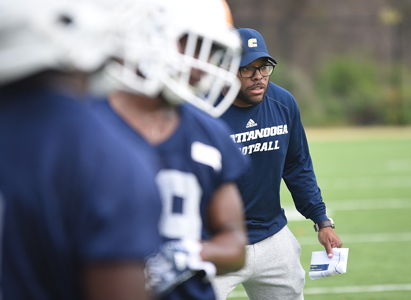 UTC defensive backs coach Jonathan Cooley instructs during a drill Tuesday on the first day of spring practice at Scrappy Moore Field.