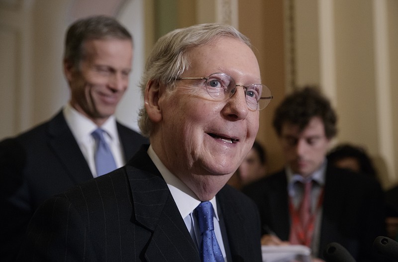 
              Senate Majority Leader Mitch McConnell of Ky., joined at rear by Sen. John Thune, R-S.D., speaks to reporters about the pending GOP health care bill following lunch with Vice President Mike Pence, Tuesday, March 31, 2017, on Capitol Hill in Washington. (AP Photo/J. Scott Applewhite)
            