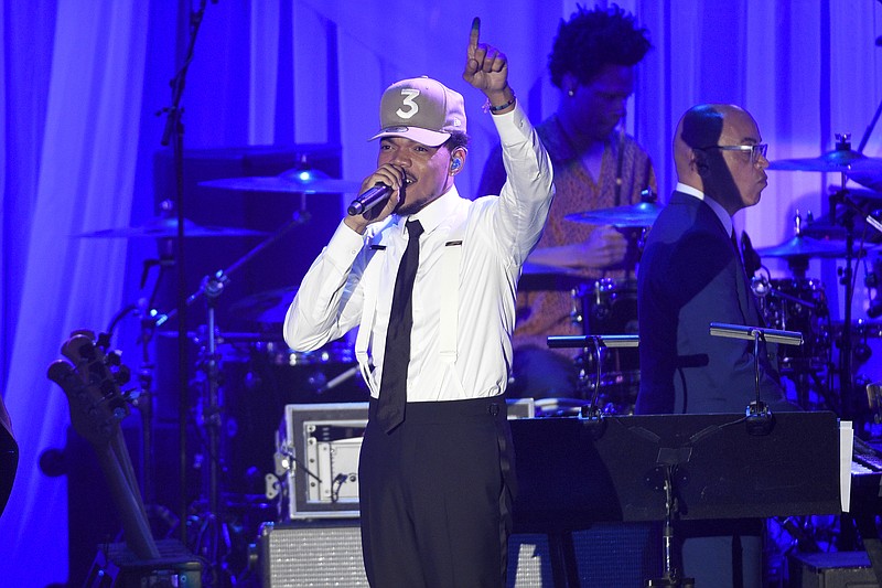 
              FILE - In this Saturday, Feb. 11, 2017, file photo, Chance the Rapper performs at the Clive Davis and The Recording Academy Pre-Grammy Gala at the Beverly Hilton Hotel in Beverly Hills, Calif. Grammy-winning artist Chance the Rapper is planning a return to his hometown of Chicago summer 2017 to headline the Lollapalooza music festival. (Photo by Chris Pizzello/Invision/AP, File)
            