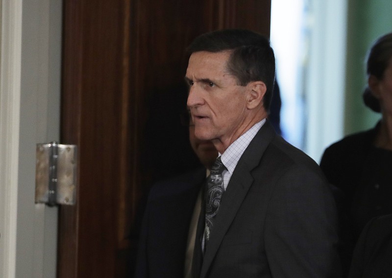 
              FILE - In this Feb. 13, 2017 file photo, then-National Security Adviser Michael Flynn arrives in the East Room of the White House in Washington. A House committee wants the White House and Trump administration officials to detail all the payments and contacts that Flynn had with foreign government representatives spanning the past three years.  (AP Photo/Evan Vucci, File)
            